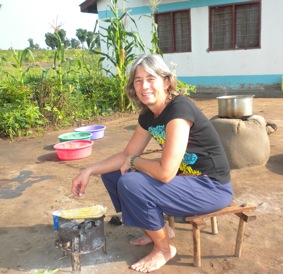 Roasting fresh maize corn and sitting on my little bamboo stool from Congo.